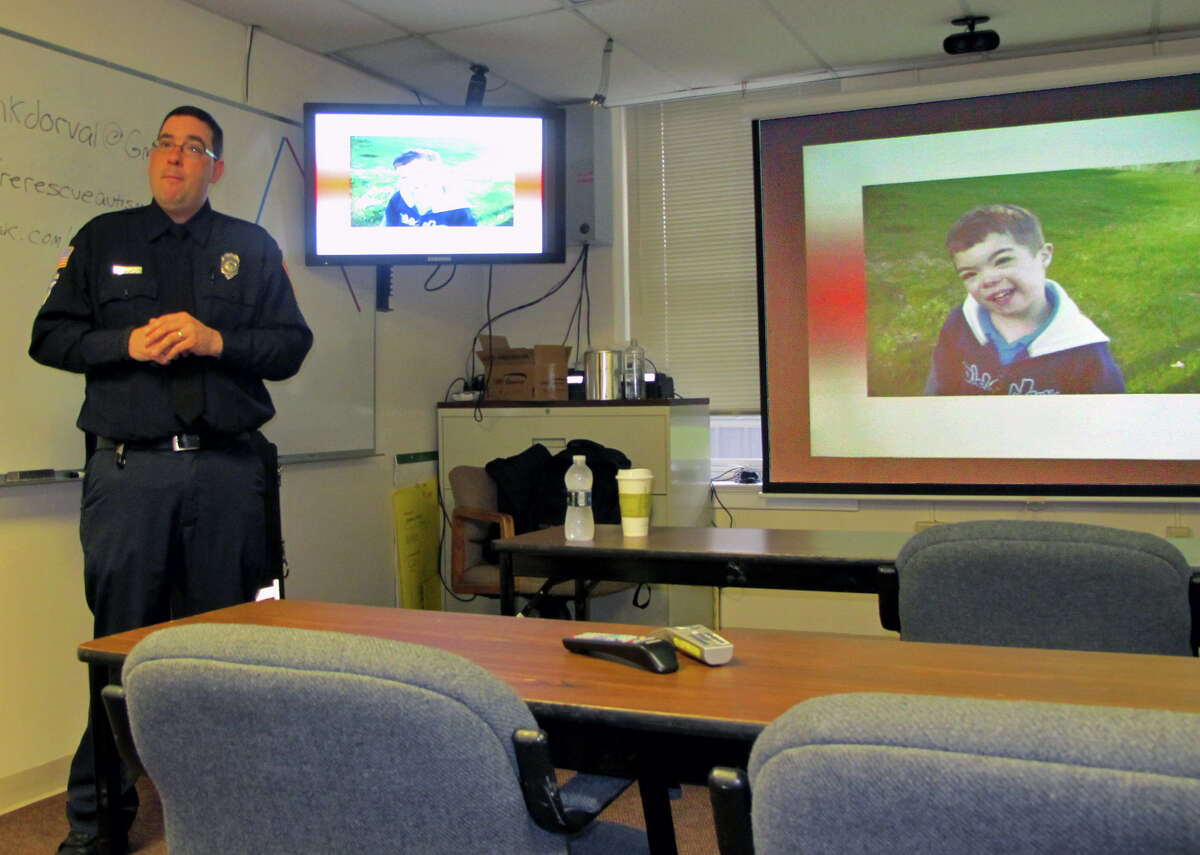 Jason Dorval, a firefighter and paramedic in Whately, Mass., led a training session on recognizing the signs of autism for first responders at the Milford Fire Department in Milford, Conn. on Friday, May 16, 2014. Dorval's son, Connor (picture), has autism and DownâÄôs syndrome.
