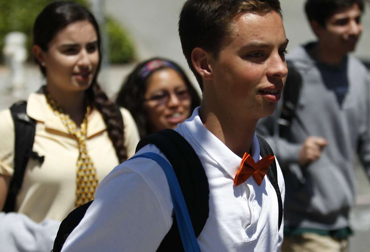 Students of Sacred Heart Cathedral Preparatory wear ties in solidarity for Jessica Urbina, a female student who's graduation photo was removed from the yearbook because she was wearing a tuxedo, on Friday, May 16, 2014 in San Francisco, Calif.