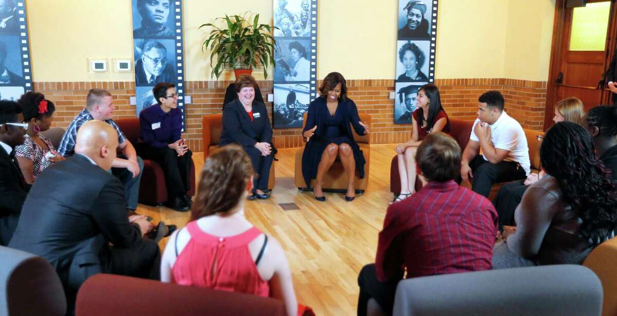 First lady Michelle Obama leads the discussion Friday with high school students at Monroe School in Topeka, Kan. It has been 60 years since Brown v. Board of Education was filed to end racial discrimination.