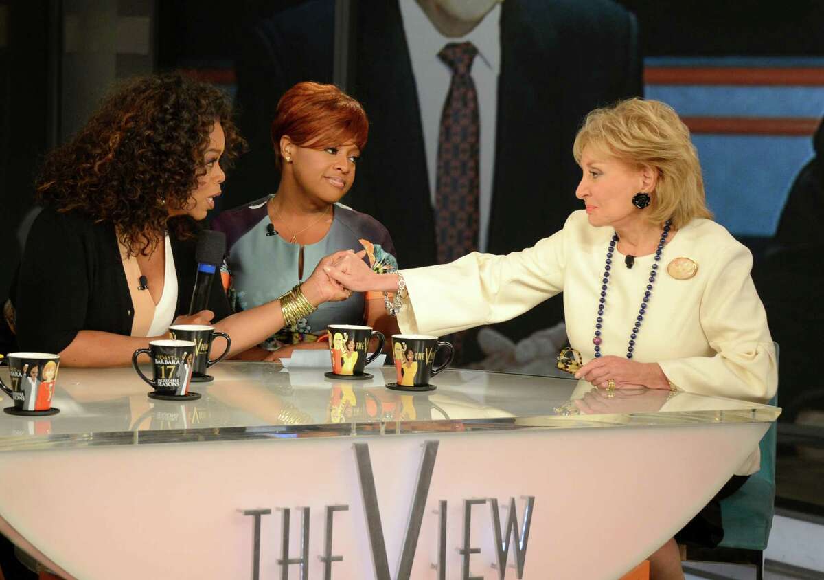 Oprah Winfrey, left, pays tribute at Barbara Walters' final co-host appearance on "The View."﻿