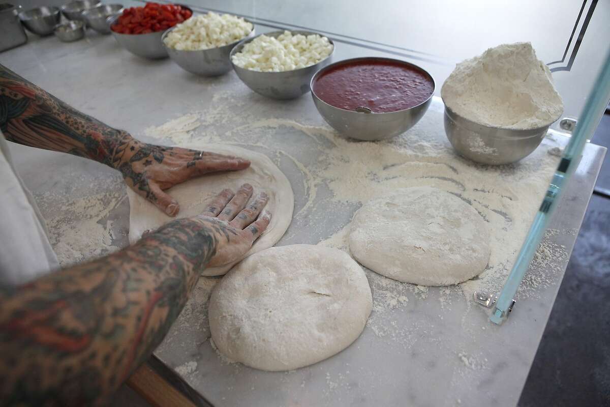 Anthony Mangieri, who has a wheat allergy, makes pizzas at his restaurant Un Pizza Napoletana in San Francisco CA, Wednesday May 14, 2014.