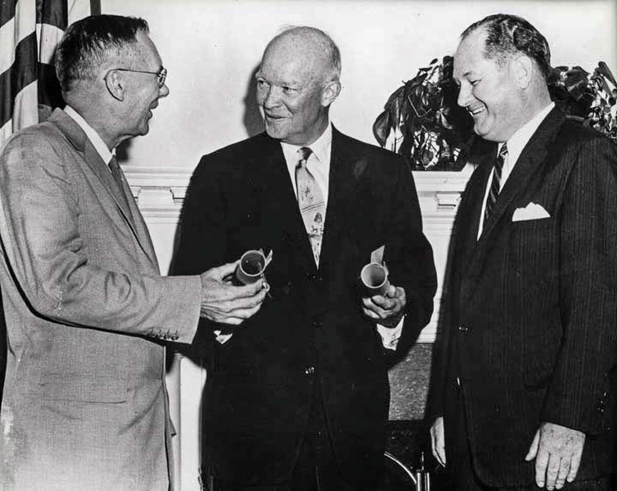 PHOTOS: NASA through the years NASA deputy administrator Hugh Dryden, from left, President Dwight Eisenhower and first administrator T. Keith Glennan celebrate the creation of NASA on Oct. 1, 1958.  >>See vintage photos of the space agency...