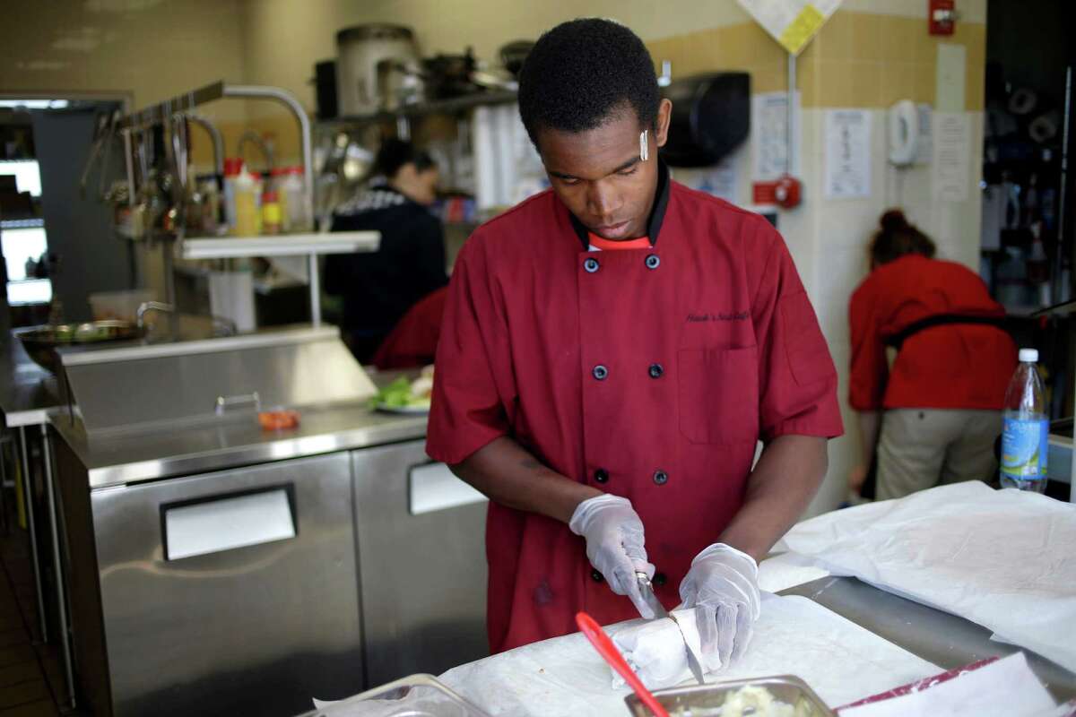 Kevin Victor, 18, prepares a wrap at a cafe in Children's Village in Dobbs Ferry, N.Y., where he lives in a cottage and participates in the culinary arts program.