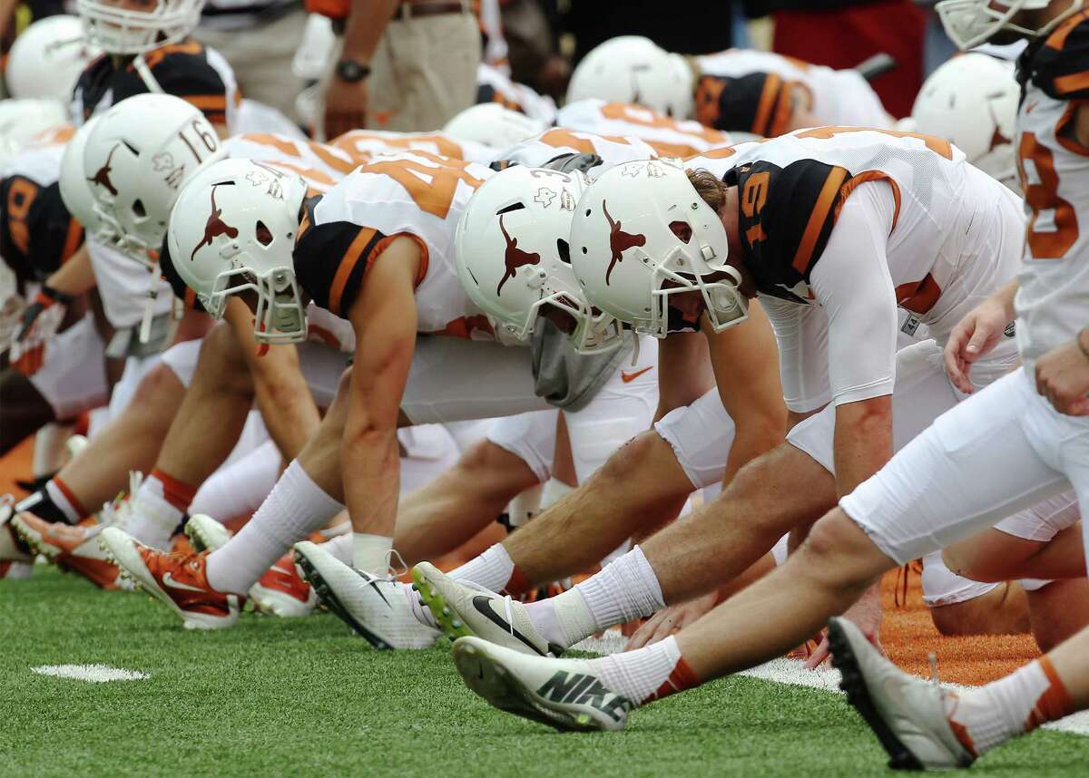 At UT, the football team, left, and the men's basketball team bring in enough dollars to fund the athletic department, but AD Steve Patterson wants an endowment system in which each sport supports itself.﻿