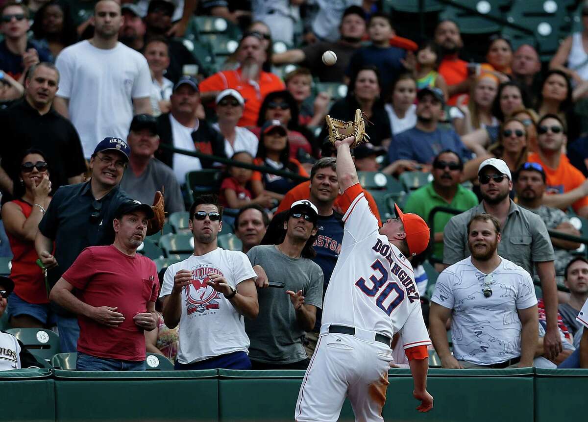 It took quite a stretch for third baseman Matt Dominguez to haul in White Sox third baseman Conor Gillaspie's pop foul during the Astros' 6-5 win.