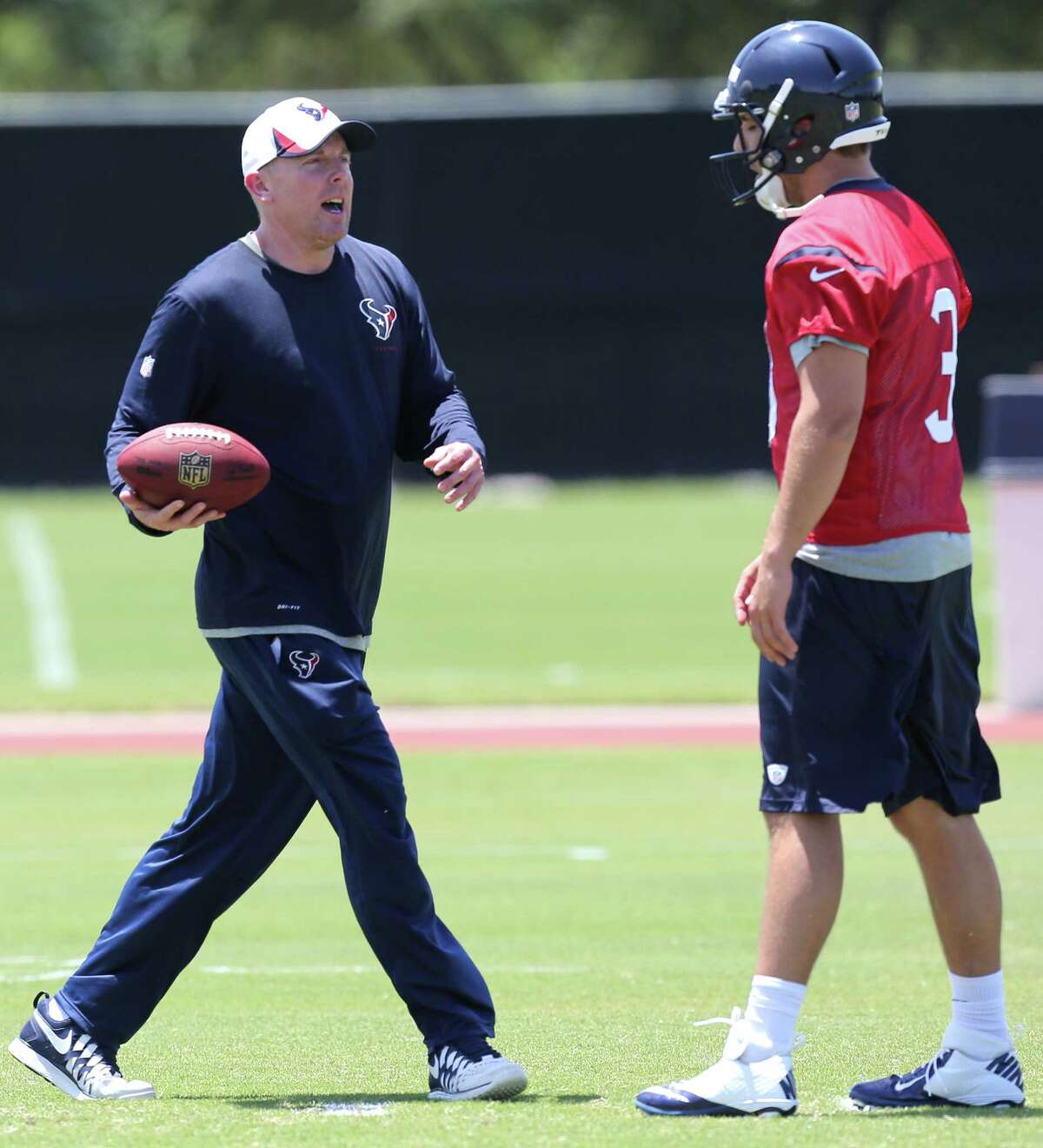 Quarterbacks coach George Godsey, left, was able to give his undivided attention to Tom Savage the last three days.