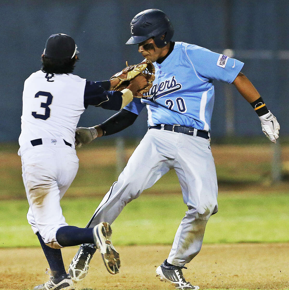 Ryan Benavidez is caught off the bag between second and third by Panther infielder Nate Miranda as O'Connor plays Carroll in game 1 of the 5A regional quarterfinal match at SAISD Spring Sports Complex on May 15, 2014.
