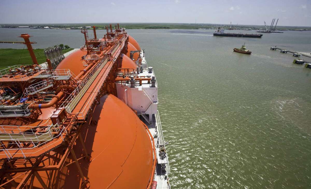 An oil tanker (right) cruises past a new liquefied natural gas tanker in Louisiana. Texas Gov. Rick Perry is critical of the Obama administration's handling of energy issues.