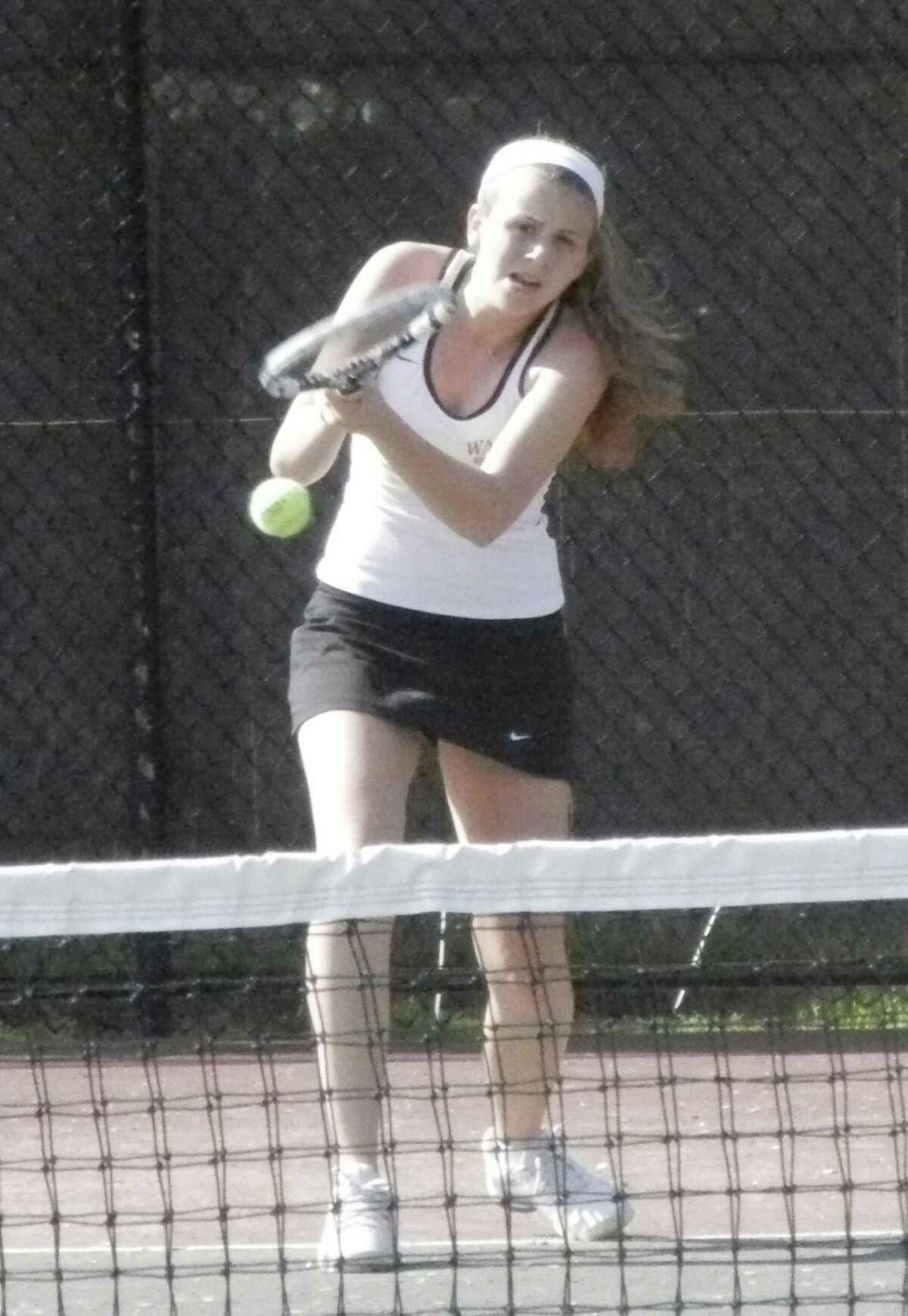 Fairfield Warde sophomore Jenny Schneider returns a shot to her Ridgefield opponent at No. 2 singles in the Mustangs' 5-2 victory over the Tigers in an FCIAC girls tennis match on Monday, May 19 at the James Blake Courts in Fairfield. Scheider lost her match to Olivia Beatty 6-4, 6-2.