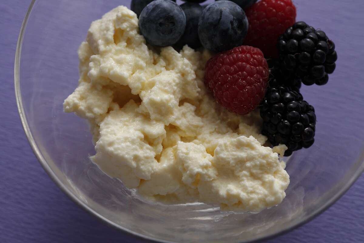 Ricotta cheese in a bowl sprinkled with vanilla sugar topped with berries as seen in San Francisco, California, on May 14, 2014. Food styled by Lynn Char Bennett.