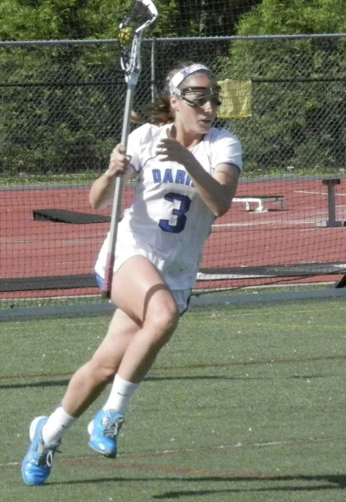 Darien senior Dillon Schoen (3) races upfield against Fairfield Ludlowe in an FCIAC girls lacrosse game on Tuesday, May 20 in Darien. The Blue Wave defeated the Falcons 18-5. Schoen contributed with two goals and one assist.