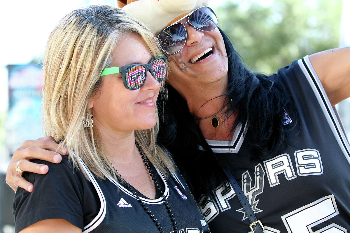 Loriann Williams and Ronnie Morin pose for a photo as Spurs fans start to party before the opener against the Thunder at the AT&T Center on May 19, 2014.