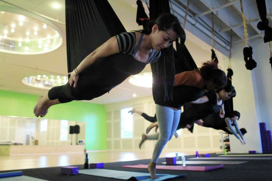 Aerial Yoga Houston helps you fly high, stretch long Houston Chronicle