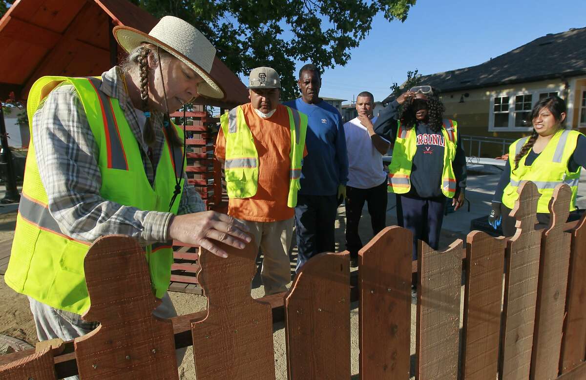 Toody Maher (left) advises a team of paid staff rebuilding Pogo Park in Richmond, Calif. on Tuesday, May 6, 2014, in preparation for the park's grand opening in the fall. They are: Richard Muro, Daniela Guadalupe, Jose Juan Reyes, Eddie Doss, Karina Guadalupe and Tonie Lee.