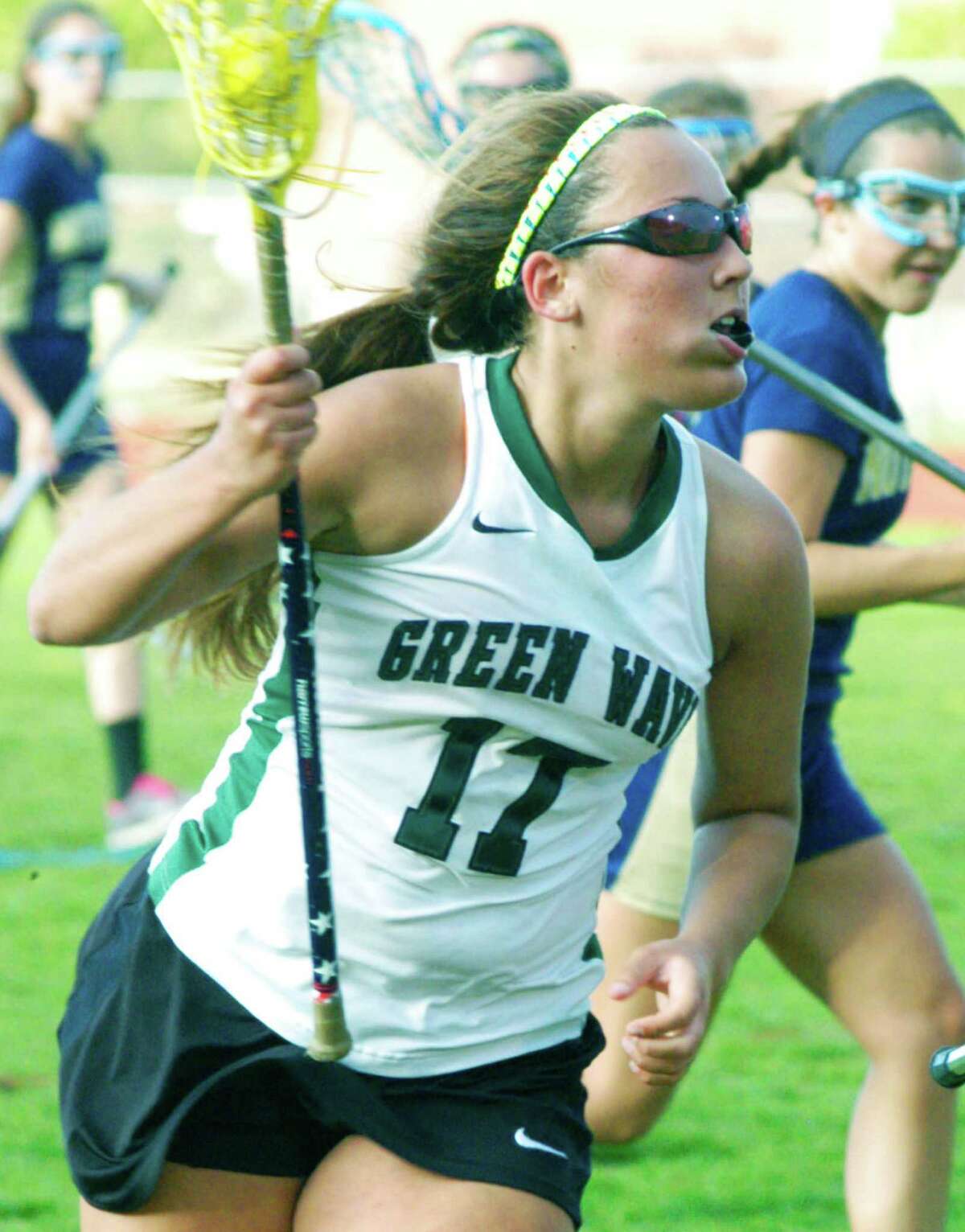 Green Wave standout Marisa McLaughlin searches for a seam in the Lancers' defense as she romps toward the net during New Milford High School girls' lacrosse's 16-5 victory over Notre Dame of Fairfield, May 14, 2014 at NMHS.