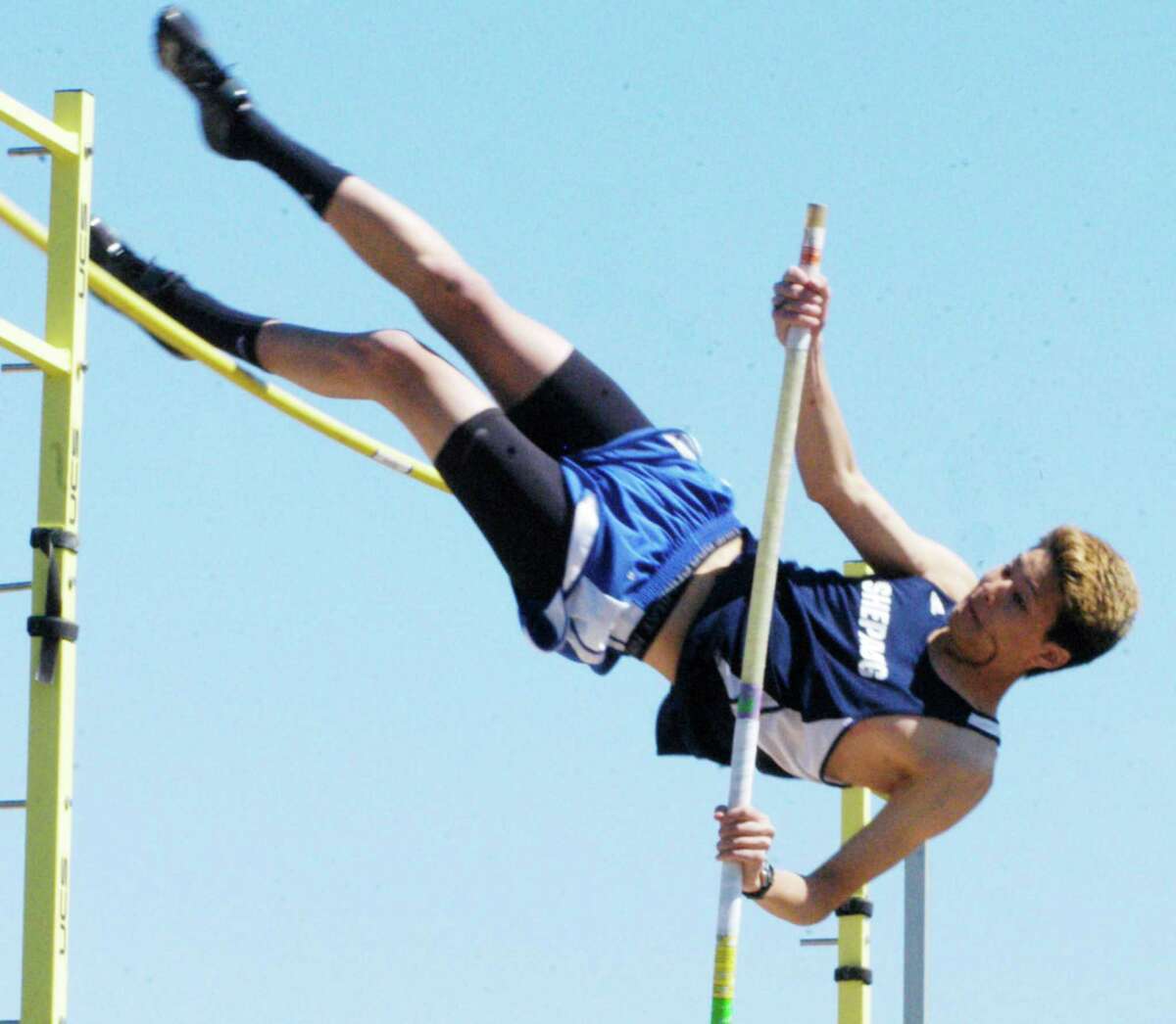 Spartan senior Nathan Ong shrugs off injury to score points in the pole vault for the Shepaug Valley High School boys' track and field team at the Berkshire League championship meet, May 17, 2014 in Litchfield.