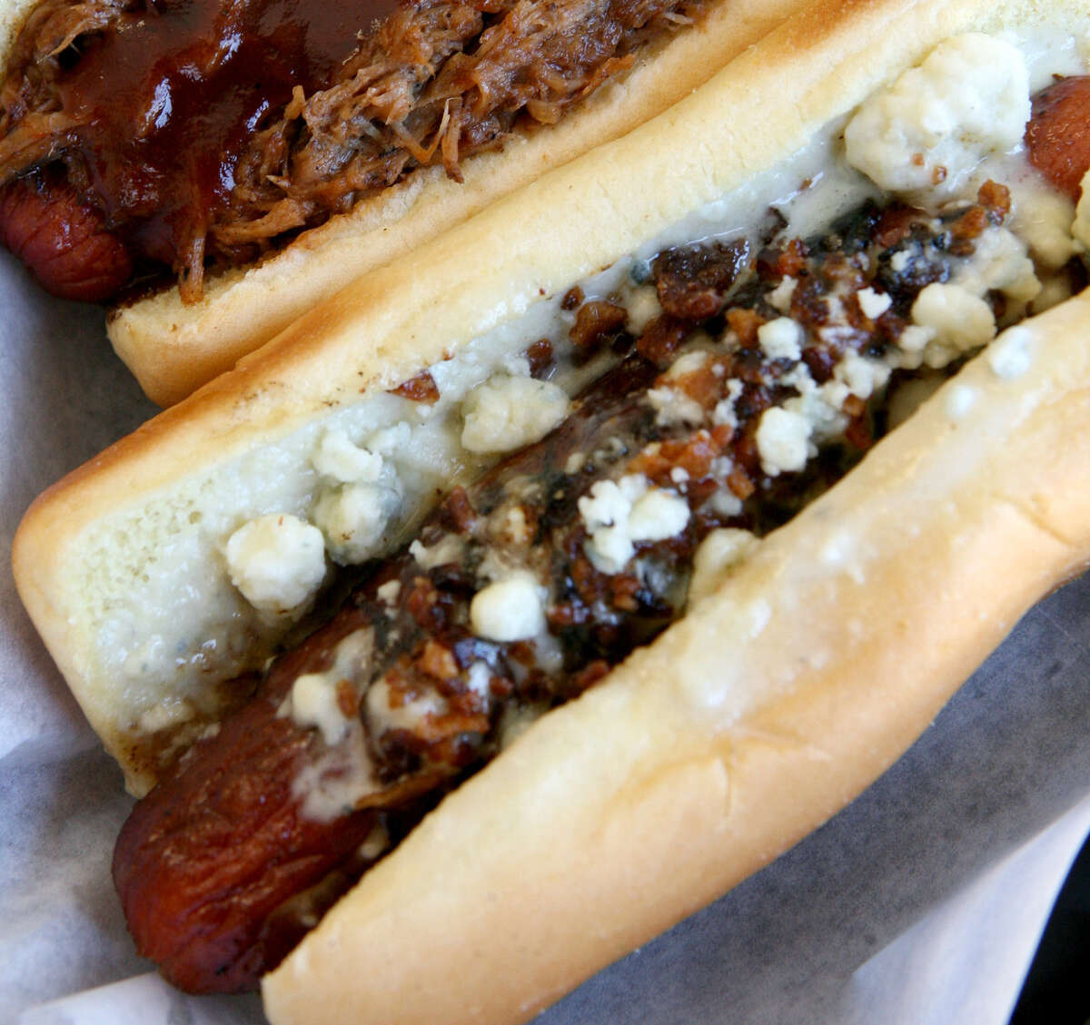 The pork dog (top) and the SA dog are served at the Original San Antonio Hot Dog House, which won Readers' Choice Best Hot Dog.