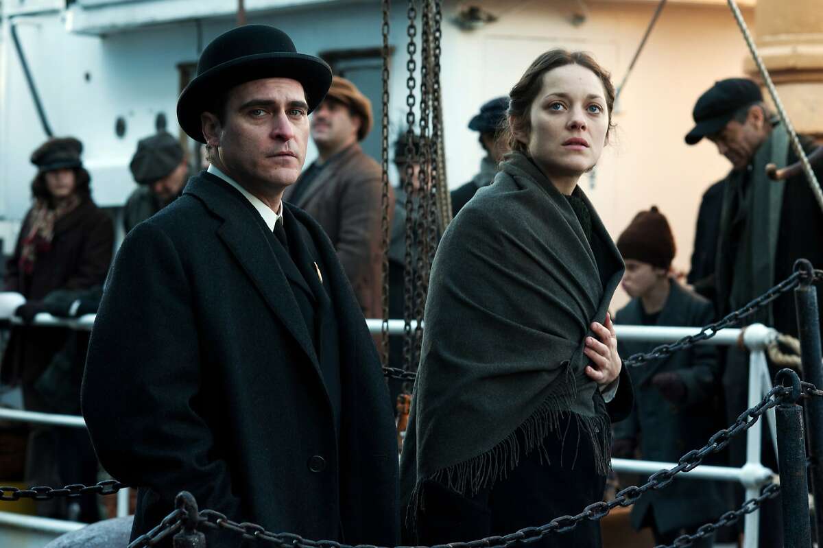 This photo released by the Weinstein Company shows Joaquin Phoenix, left, and Marion Cotillard in a scene from the film, "The Immigrant." The movie opens in the U.S. with a limited release on May 16, 2014. (AP Photo/The Weinstein Company, Anne Joyce)
