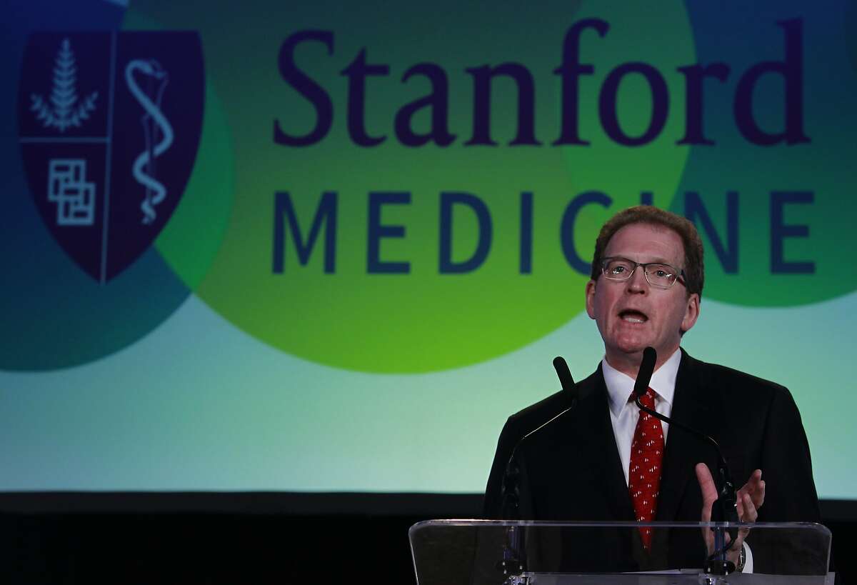 Lloyd Minor, dean of the Stanford University School of Medicine, greets attendees of the Big Data in Biomedicine conference in Stanford in 2014.