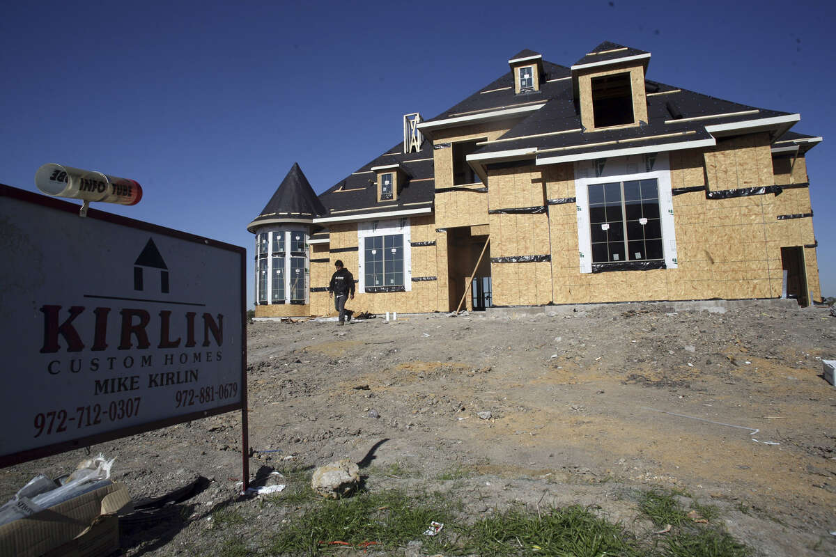 FRISCO, TEXAS - NOVEMBER 17: A new house is under construction in a new exurb of Dallas November 17, 2006 in Frisco, Texas. New home construction plunged 14.6 percent in October, the lowest level in more than seven years, according to a commerce department report released November 17, 2006. The slump in housing starts may signal that the worst is not over for the cooling residential property market. (Photo by Brian Harkin/Getty Images)
