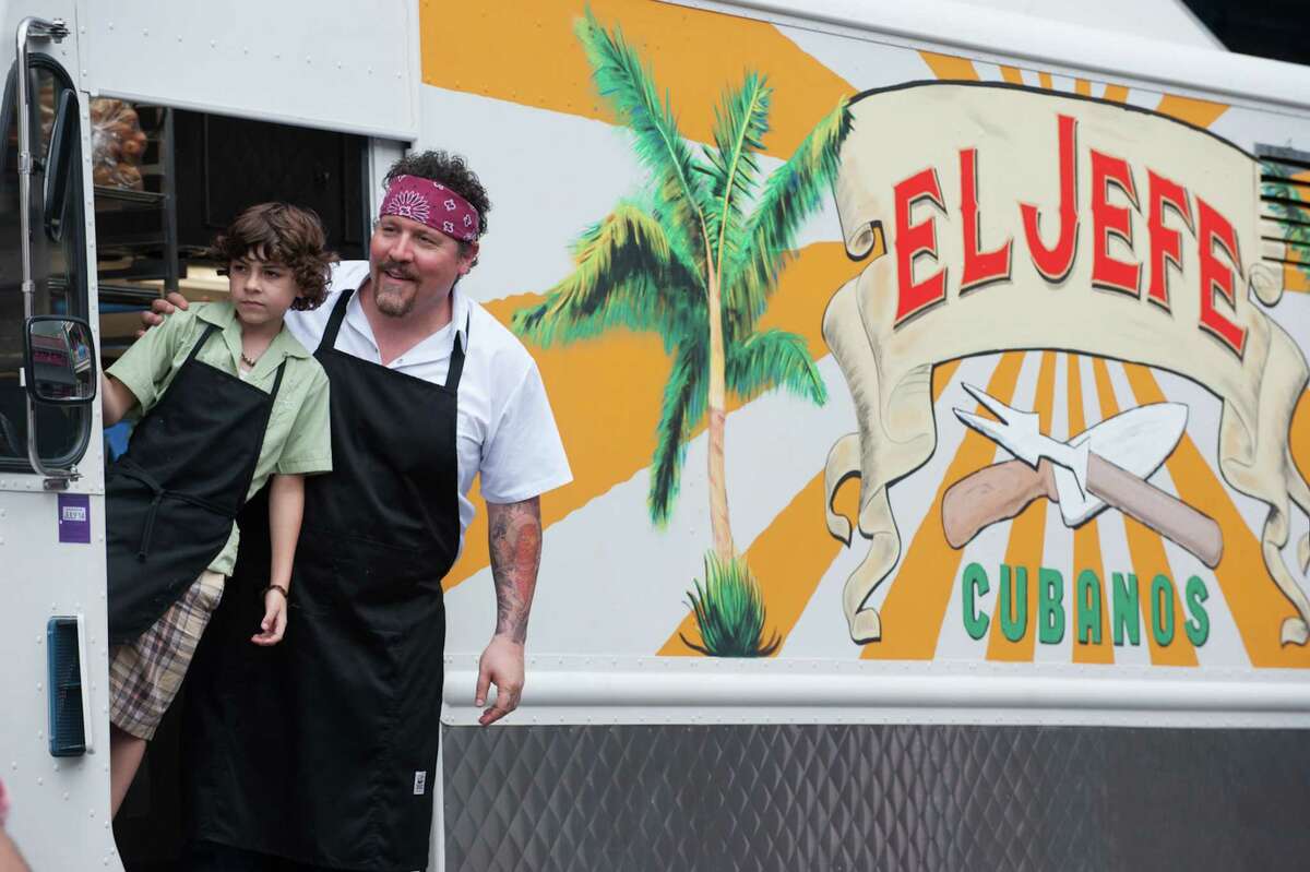 This image released by Open Road Films shows Emjay Anthony, left, and Jon Favreau in a scene from "Chef." (AP Photo/Open Road Films, Merrick Morton)