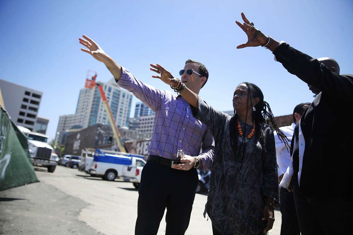 Michael Ghielmetti (l to r), president Signature Development Group, Konda Mason, Impact Hub Oakland co-director/CEO and Ashara Ekundayo, Impact Hub Oakland chief creative officer, talk as they look at construction in an area of the Hive, a mixed-use project in Oakland's Uptown district, on Wednesday, May 21, 2014 in Oakland, Calif.
