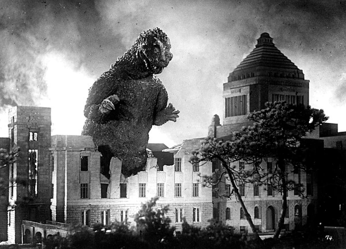 Godzilla demolishes Japan's Parliament building in his 1954 film debut, the first of many movies featuring the fire-breathing creature -- the latest of which is now playing in area theaters.