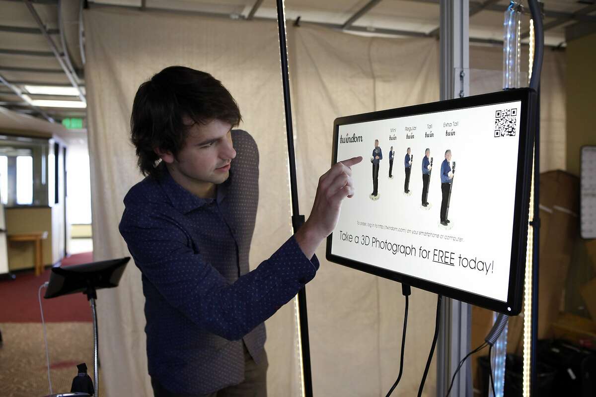 CEO David Pastewka looks at a 3D image of customer Scott Page who was just scanned at Twindom's offices in Berkeley, CA, Thursday May 22, 2014. Twindom creates 3D printed miniature figurines of real people using a rotating body scan capture system and 3D printers.