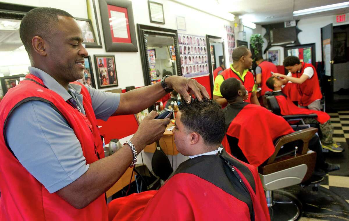 Artist-turned-barber builds Stamford hairdressing empire