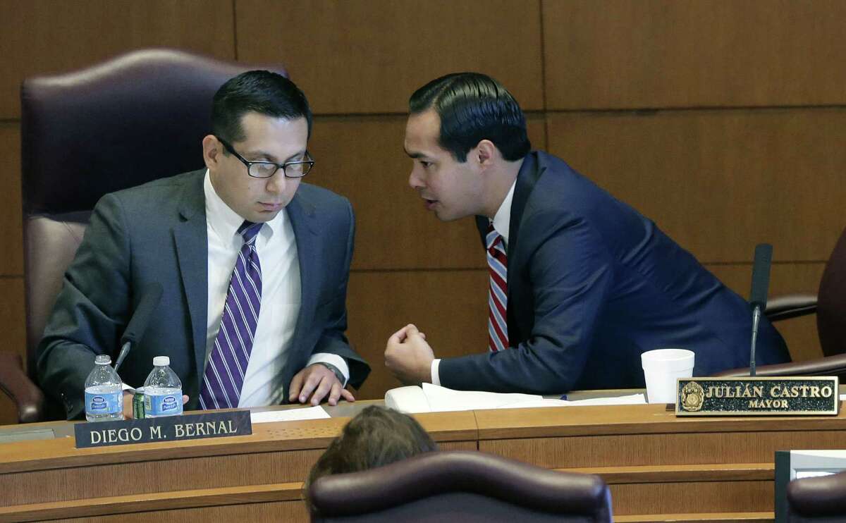 San Antonio Mayor Julián Castro (right) talks with Councilman Diego Bernal at a City Council session. Some wonder if Castro's “Decade of Downtown” will survive if he departs for an appointment to President Barack Obama's Cabinet.