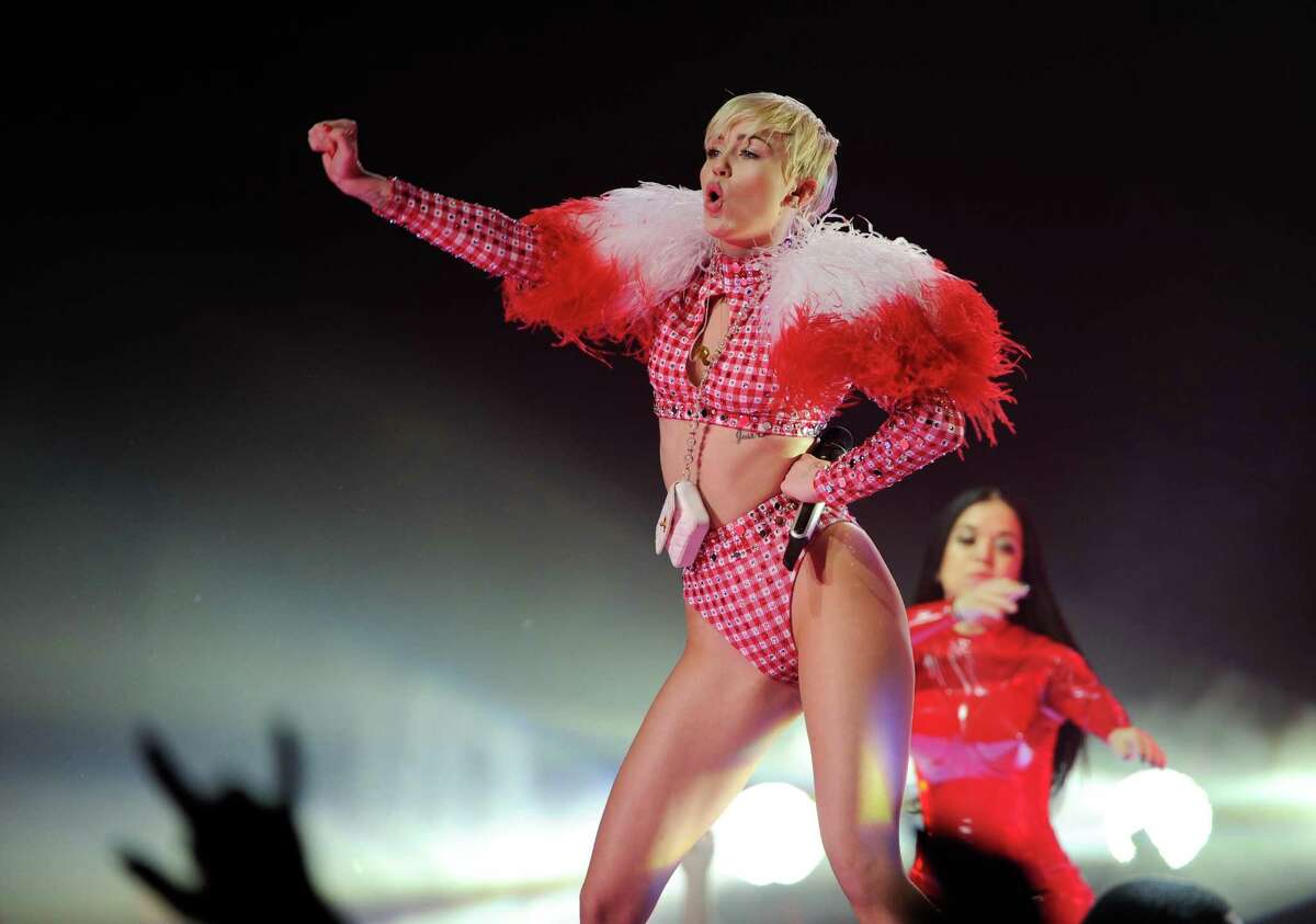 FILE - In this Saturday, April 5, 2014 file photo, singer Miley Cyrus performs at the Barclays Center in New York. Cyrus has obtained a temporary restraining order against an Arizona man who was recently detained by police for trying to meet the singer-actress. A Los Angeles judge granted Cyrus a temporary restraining order against 24-year-old Devon Meek on Friday, May 23, 2014. (Photo by Evan Agostini/Invision/AP, file)