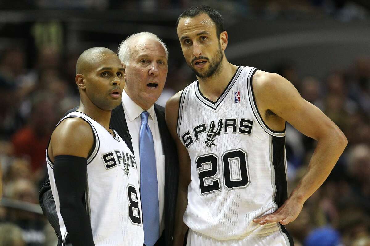 SAN ANTONIO, TX - MAY 21: Head coach Gregg Popovich of the San Antonio Spurs talks with Patty Mills #8 and Manu Ginobili #20 in the first half while taking on the Oklahoma City Thunder in Game Two of the Western Conference Finals during the 2014 NBA Playoffs at AT&T Center on May 21, 2014 in San Antonio, Texas. NOTE TO USER: User expressly acknowledges and agrees that, by downloading and or using this photograph, User is consenting to the terms and conditions of the Getty Images License Agreement. (Photo by Ronald Martinez/Getty Images)