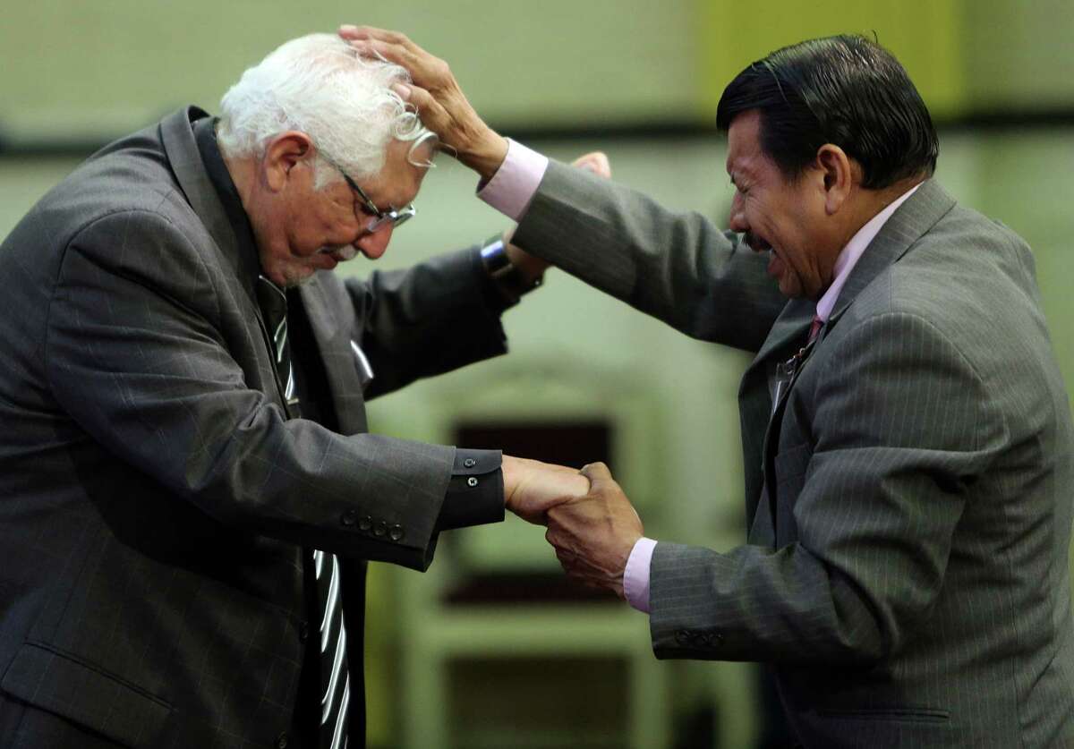 Pastor Roberto Ruben Villarreal is blessed by elder Andres Salmeron during a Spanish service at La Iglesia Del Pueblo on May 21, 2014, in Pasadena, Tx. La Iglesia Del Pueblo, a non-denominational spanish-language church, is launching an english-language service.