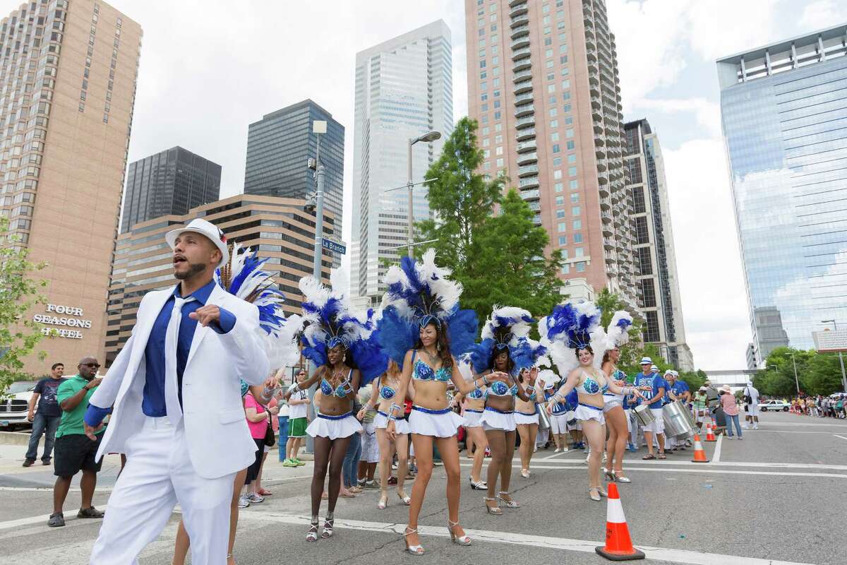Members of the Austin Samba School perform along the parade route to an appreciative crowd.