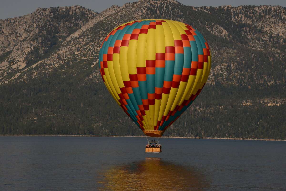 A hot air balloon floats high above Lake Tahoe for the view, but some of the excitement is when you just touch the water.