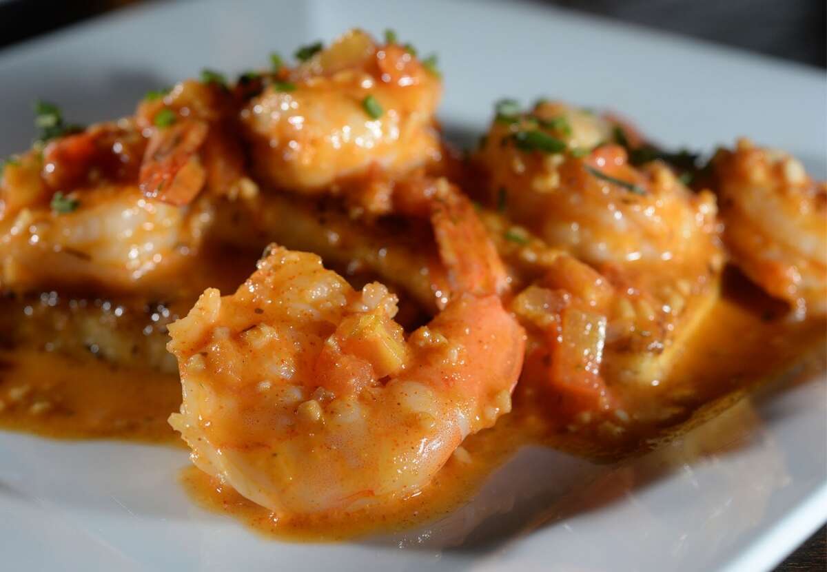 Shrimp and grits topped with a tomato based cream sauce at the Neches River Wheelhouse in Port Neches. Photo taken Tuesday, May 13, 2014 Guiseppe Barranco/@spotnewsshooter