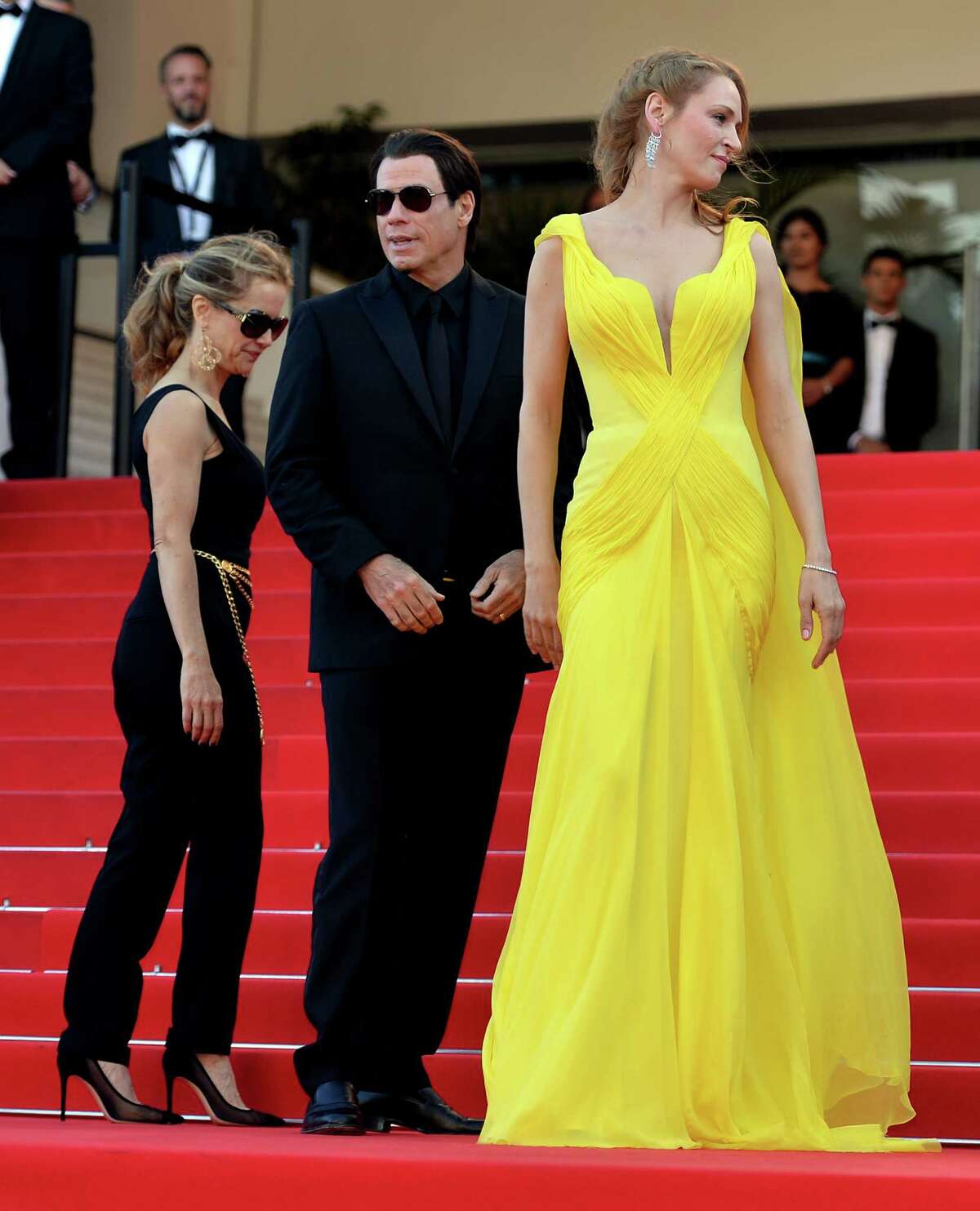 (L to R) US actress Kelly Preston, US actor John Travolta and US actress Uma Thurman attend "Sils Maria" (Clouds of Sils Maria) film screening in competition during the 67th Cannes Film Festival in Cannes, France. May 23, 2014. (Photo by Mustafa Yalcin/Anadolu Agency/Getty Images)Related stories:     Turkish drama 'Winter Sleep' wins Palme d'Or     PHOTO GALLERY: Cannes' fashion highs