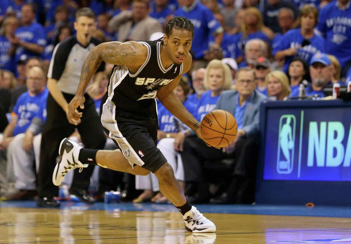 OKLAHOMA CITY, OK - MAY 25: Kawhi Leonard #2 of the San Antonio Spurs dribbles after a turnover in the first quarter against the Oklahoma City Thunder during Game Three of the Western Conference Finals of the 2014 NBA Playoffs at Chesapeake Energy Arena on May 25, 2014 in Oklahoma City, Oklahoma.
