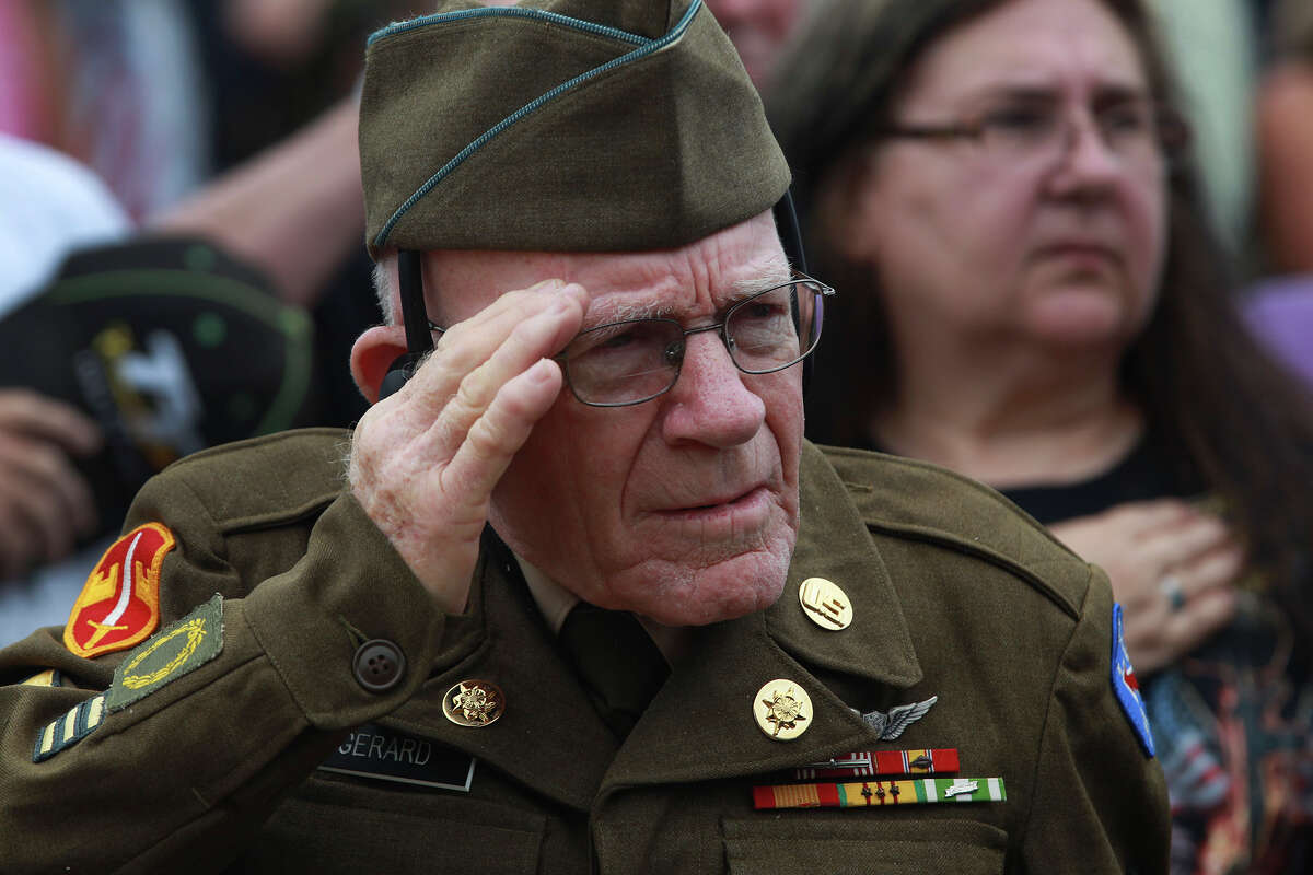 Army Sergeant James Gerard (ret.) salutes the colors Memorial Day Monday May 26, 2014 during a Memorial Day ceremony at Ft. Sam Houston National Cemetery. Gerard said he served in Korea and Vietnam.