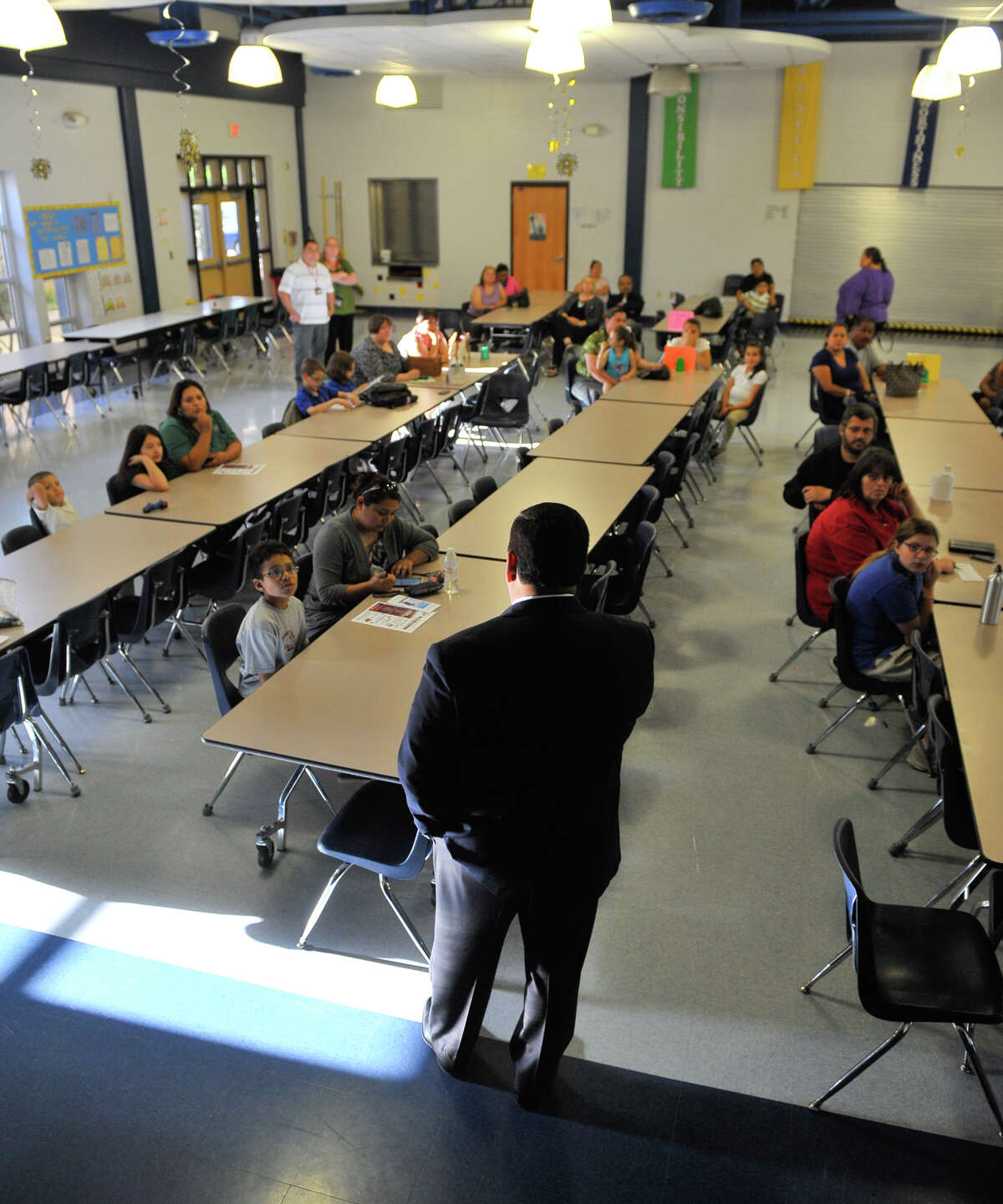 Edgewood ISD Chief Executive of Finance and Operations Eddie Ramirez answers questions about the districts new 6th Grade Acadenmy duribg a session with parents and students at Roosevelt Elementary School Tuesday evening.