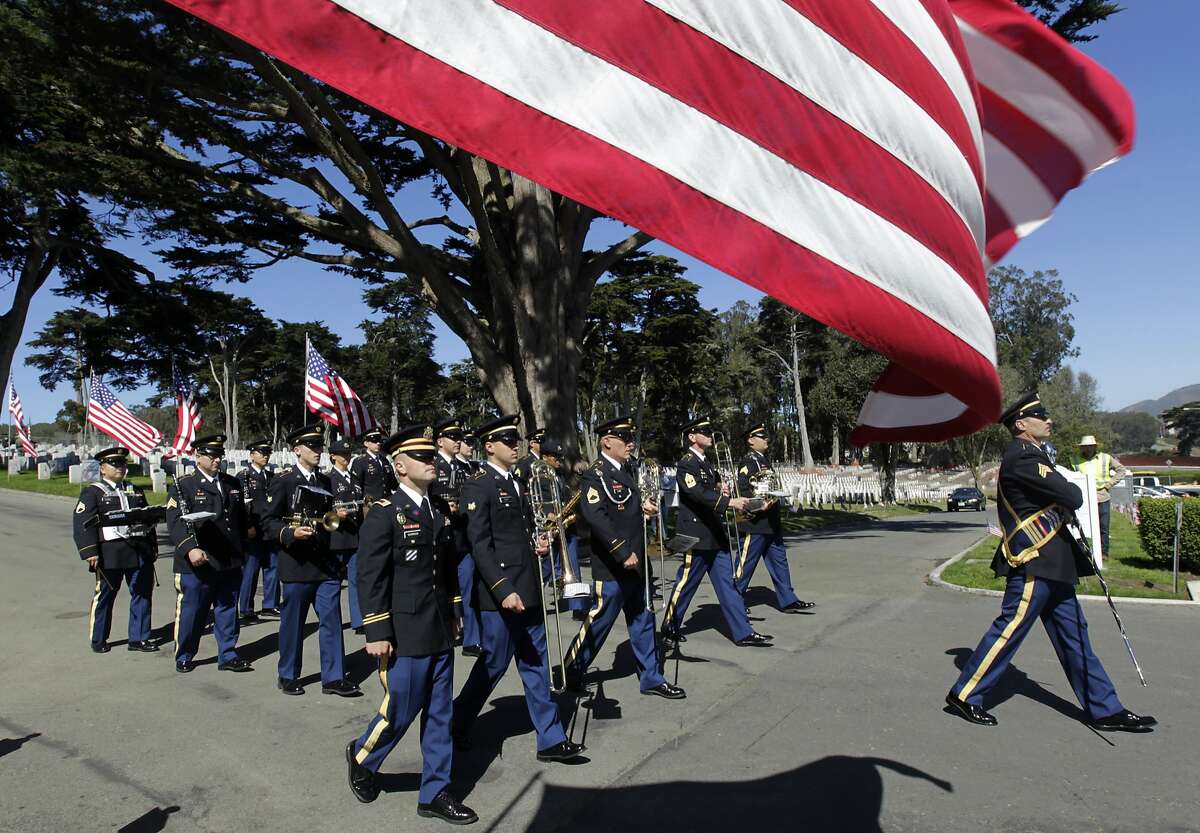 The 191st Army Band from Camp Parks marches during the Memorial Day Ceremony at the National Cemetery of The Presidio in San Francisco, Calif. on Monday, May 26, 2014.