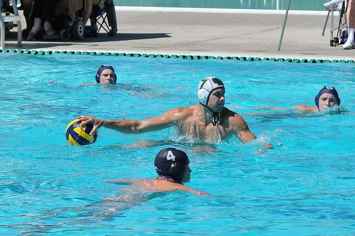 Nick Pasichuke of Alamo, who was hit by Elliot Rodger?•s car in Friday?•s rampage in Isla Vista, prepares to hurl the ball while playing on the water polo team of San Ramon Valley High School in Danville, which he graduated from last year.