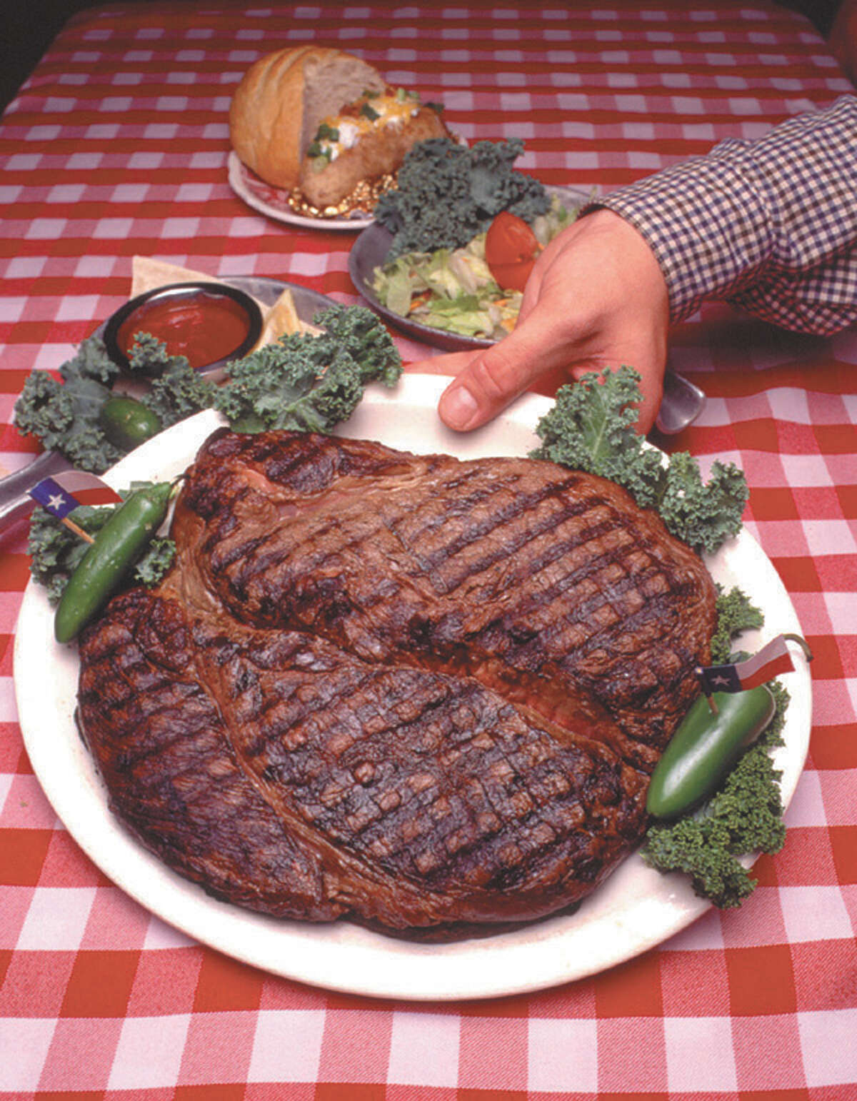 If you can eat the 72-ounce steak at the Big Texan restaurant in Amarillo in one hour, it's free. Not many succeed, but a competitive eater from Nebraska has set a record by devouring two of the huge steaks. Still hungry? While they aren't all record-breaking, click ahead to see more dishes in the Alamo City, Texas and around the globe that will fill you up ... and then some.