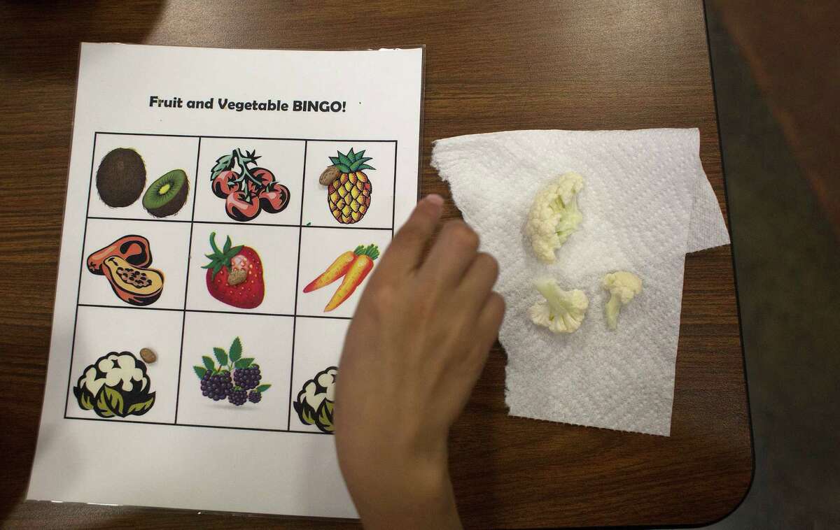Students at Veggie Fest played Fruit and Vegetable Bingo while sampling a variety of food they may never have encountered - such as cauliflower, above.
