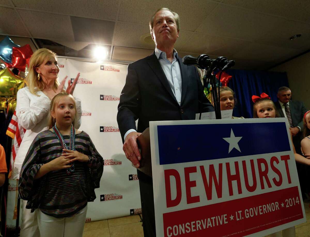Lt. Gov. David Dewhurst concedes Tuesday night with his wife, Tricia, and stepdaughter, Carolyn.