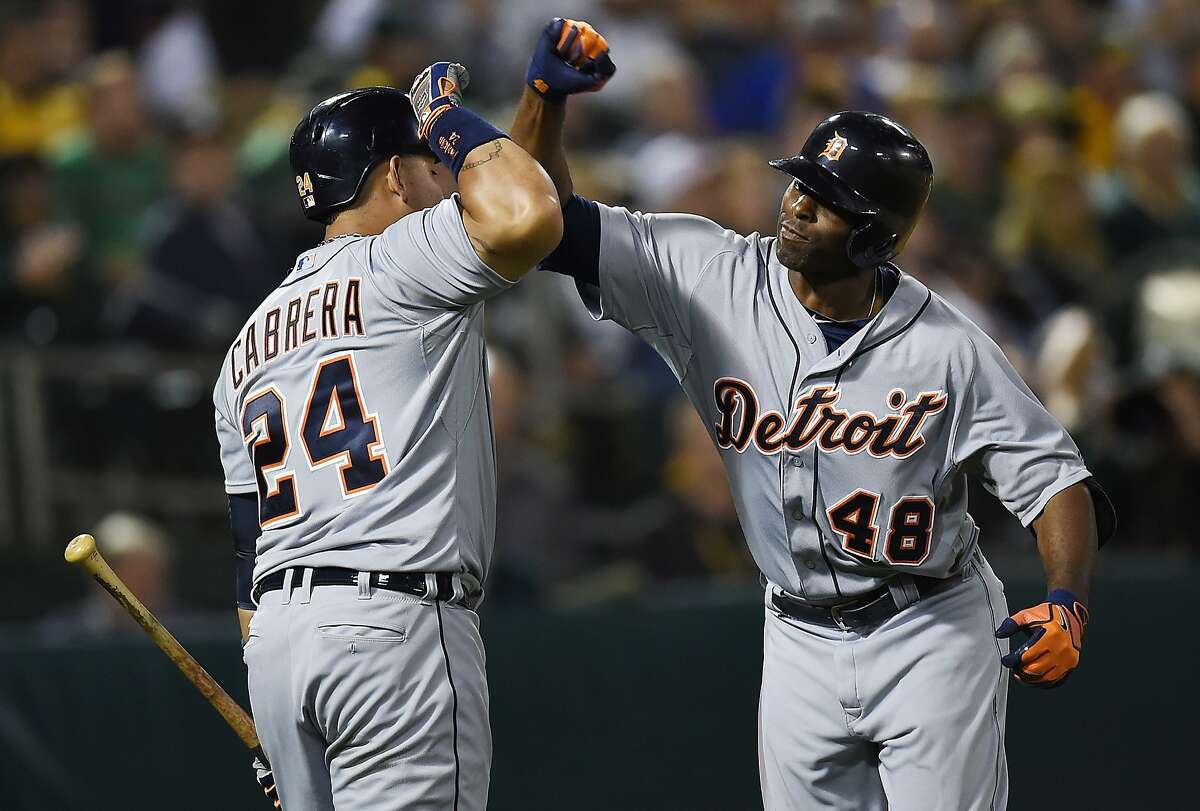 OAKLAND, CA - MAY 27: Torii Hunter #48 and Miguel Cabrera #24 of the Detroit Tigers celebrates after Hunter hit a solo home run in the top of the seventh inning against the Oakland Athletics at O.co Coliseum on May 27, 2014 in Oakland, California. (Photo by Thearon W. Henderson/Getty Images)