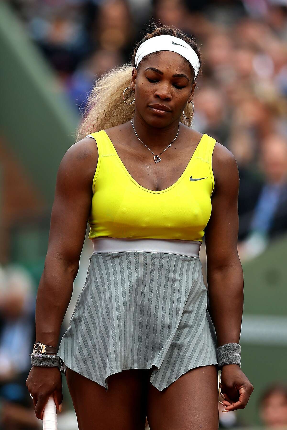 PARIS, FRANCE - MAY 28: Serena Williams of the United States reacts during her women's singles match against Garbine Muguruza of Spain on day four of the French Open at Roland Garros on May 28, 2014 in Paris, France. (Photo by Matthew Stockman/Getty Images)