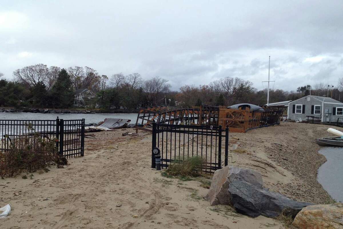 The pile of wood to the left of the boat club was the deck. During Superstorm Sandy the pounding waves tore the deck from the support beams and carried it away.