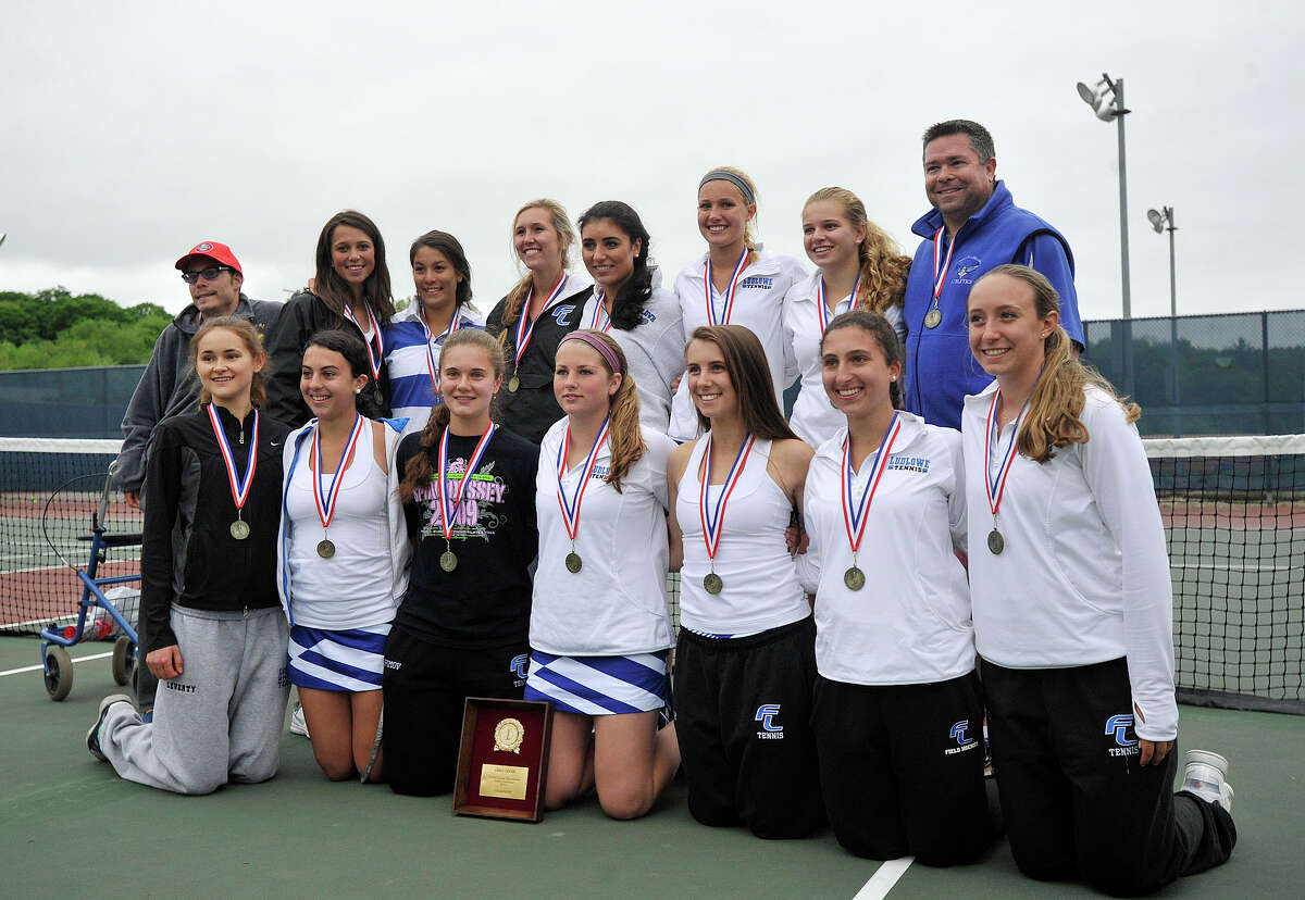 The Fairfield Ludlowe girls tennis team poses for a photograph with their FCIAC title after defeating Greenwich at Wilton High School in Wilton, Conn., on Wednesday, May 28, 2014.
