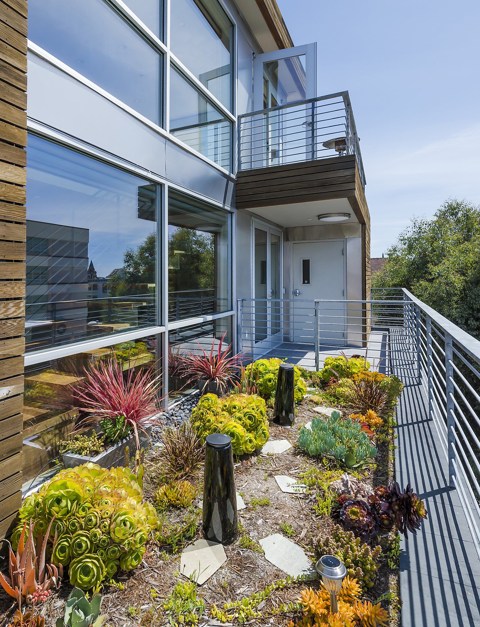 View of SF penthouse includes reclaimed materials, stellar views